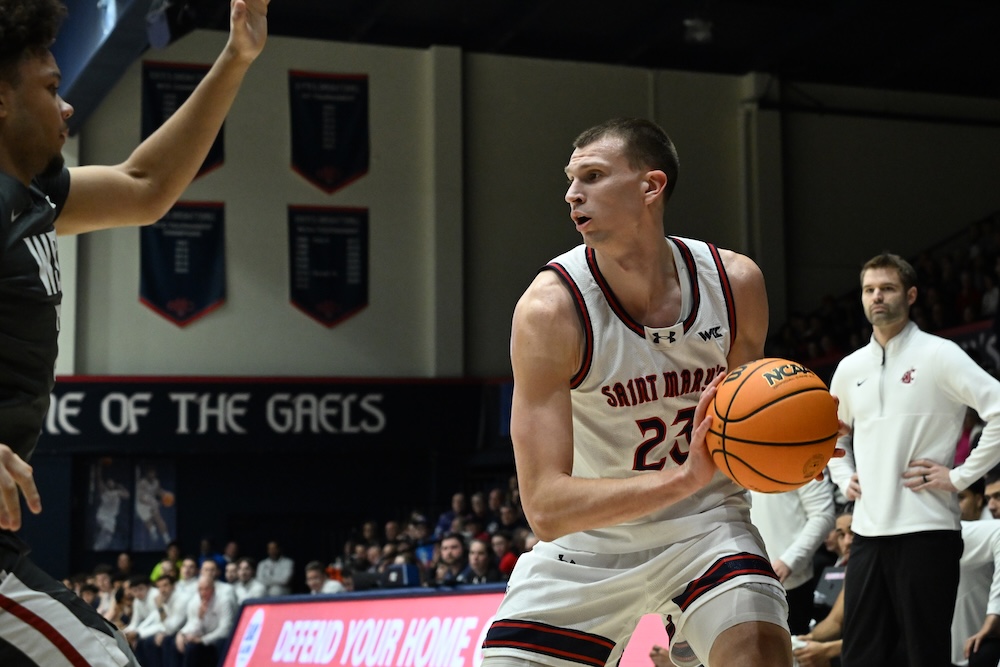 Basketball player Paulius Murauskas holds the ball while the Gaels play WSU in January 2026