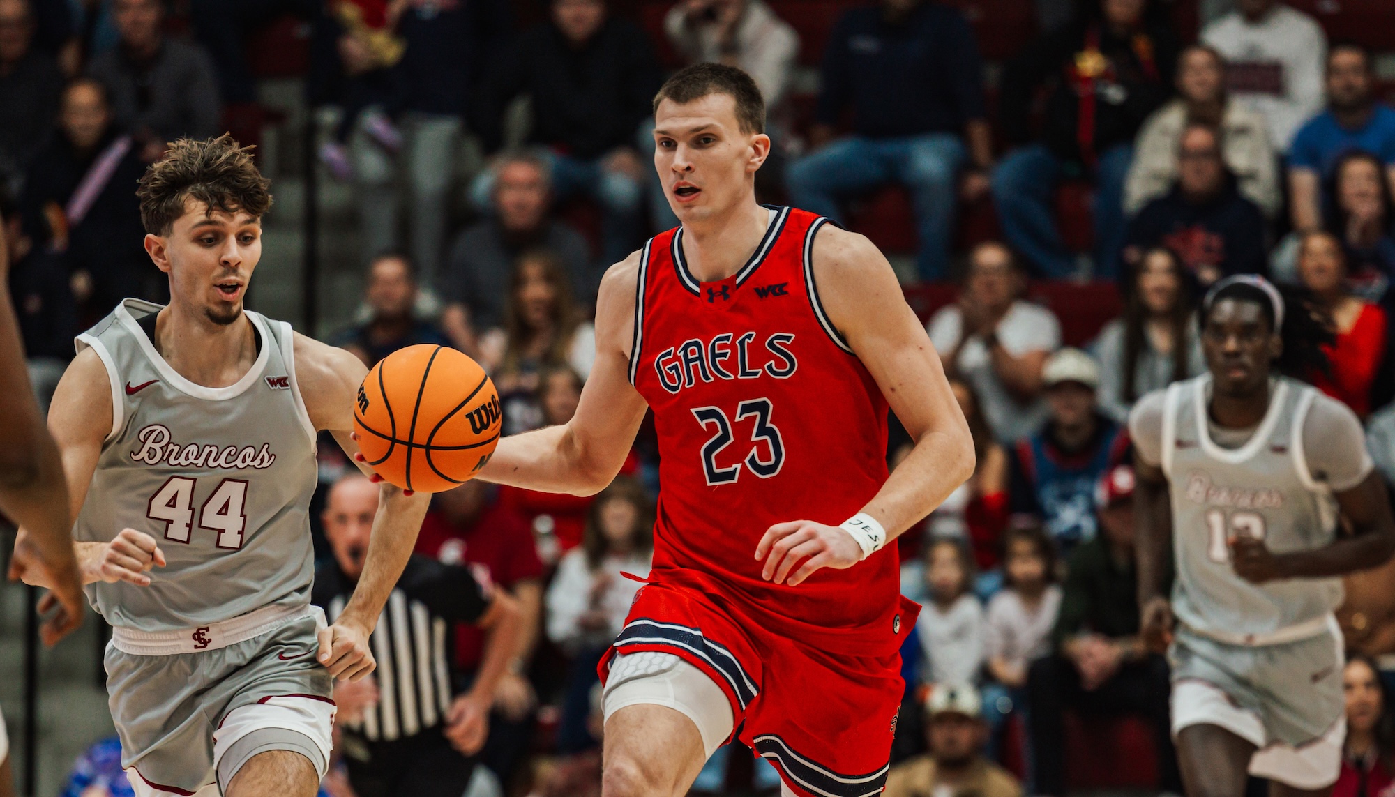 Basketball player Paulius Murauskas drives against Santa Clara in January 2026