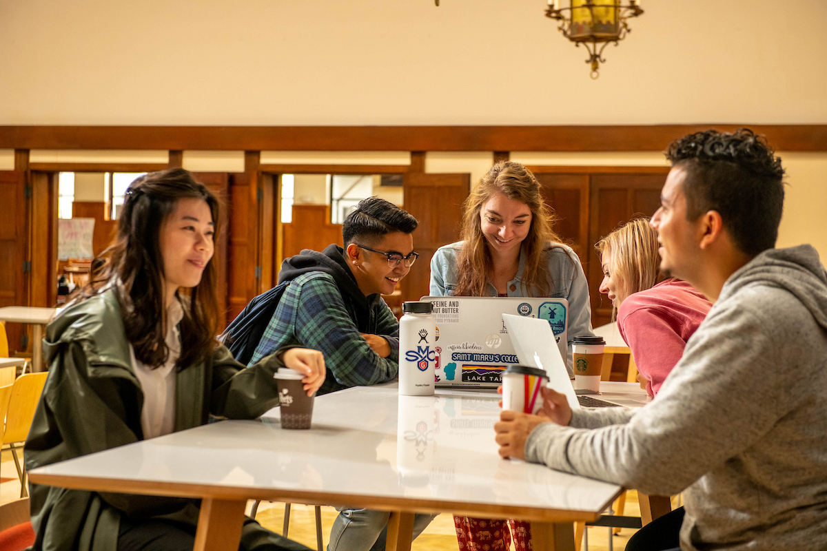 students working together on a computer
