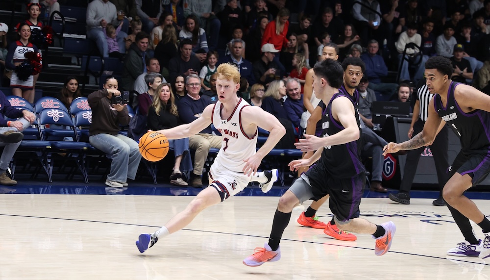 Basketball player Joshua Dent drives against Portland in January 2026