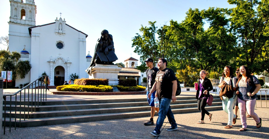 Students walking to class in front of the Saint Mary's College Chapel