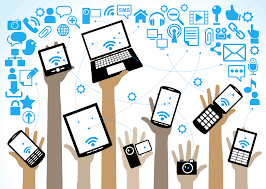 hands holding laptops and mobiles