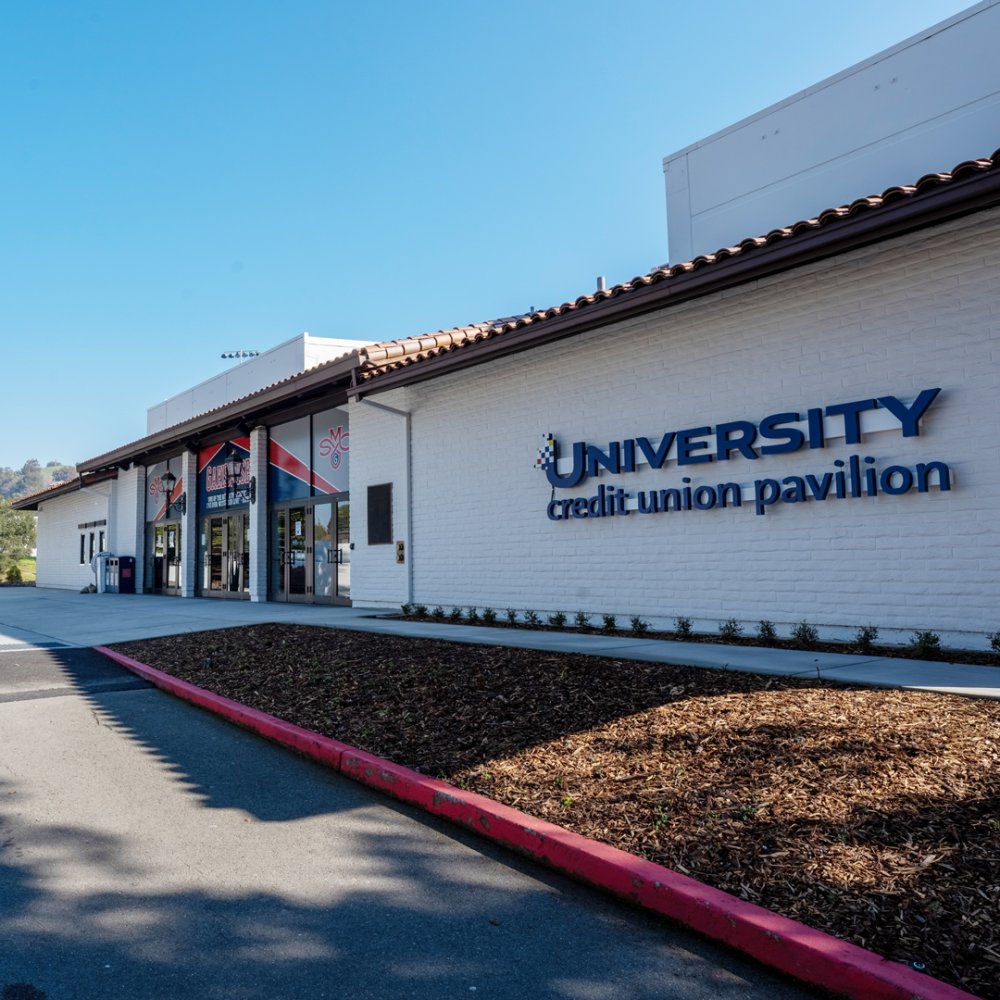 The front of the SMC gym with a sign for the University Credit Union Pavilion