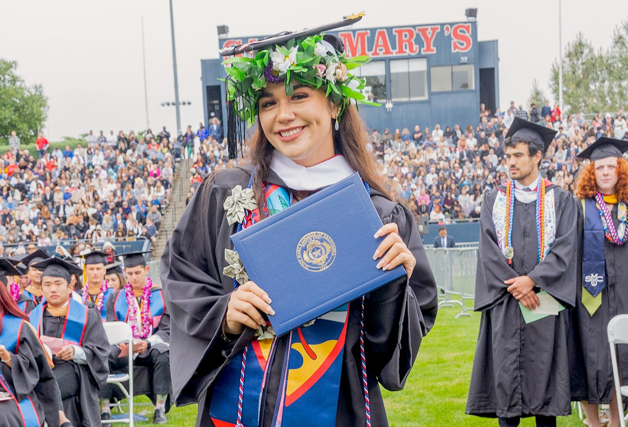 Guam student Isabellaskye Bargfrede at Commencement 2023 holding a diploma
