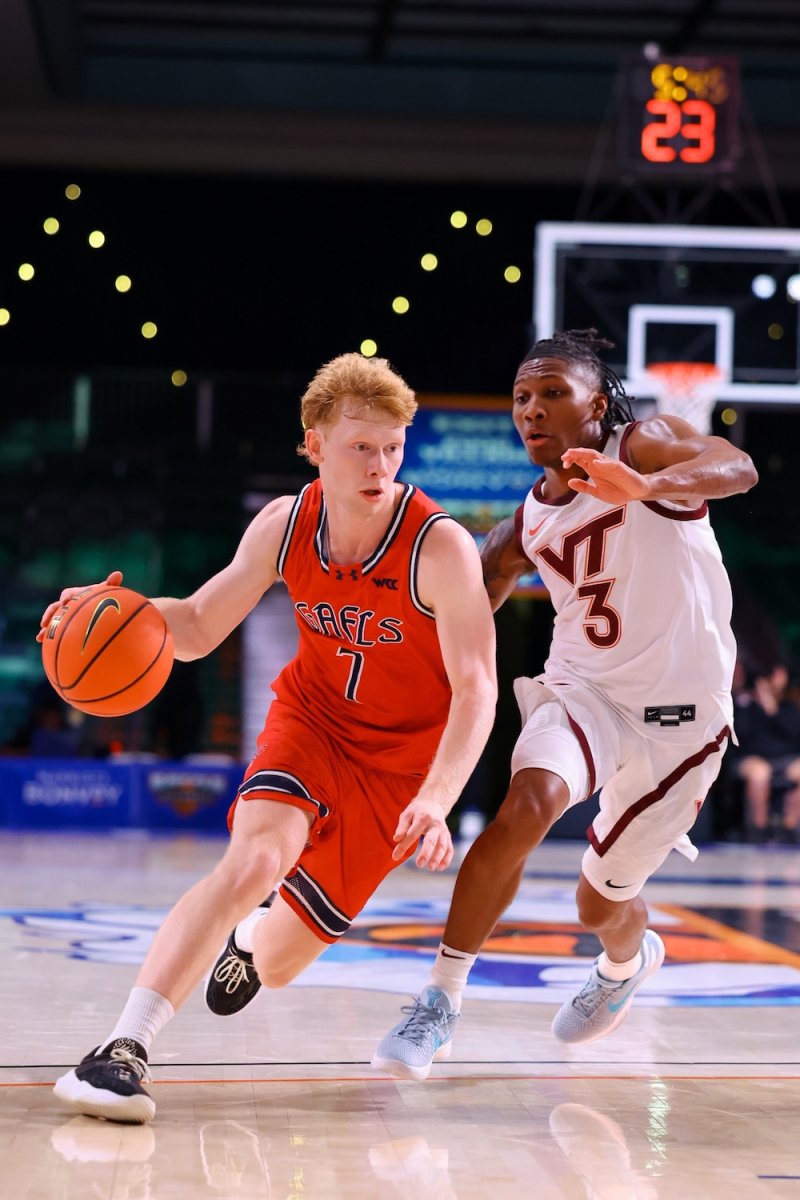 Basketball player Joshua Dent drives against Virginia Tech in November 2025