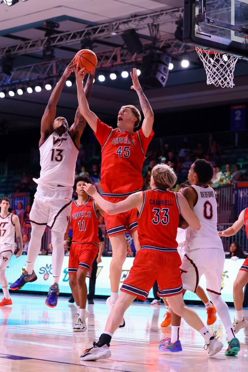 Basketball player Andrew McKeever blocks a shot against Virginia Tech in November 2025