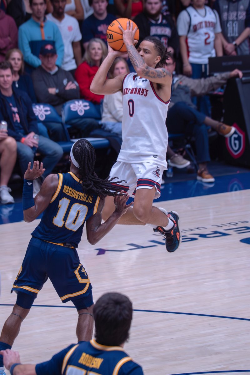 Men's basketball player Mikey Lewis shoots against Chattanooga on Nov. 8, 2025