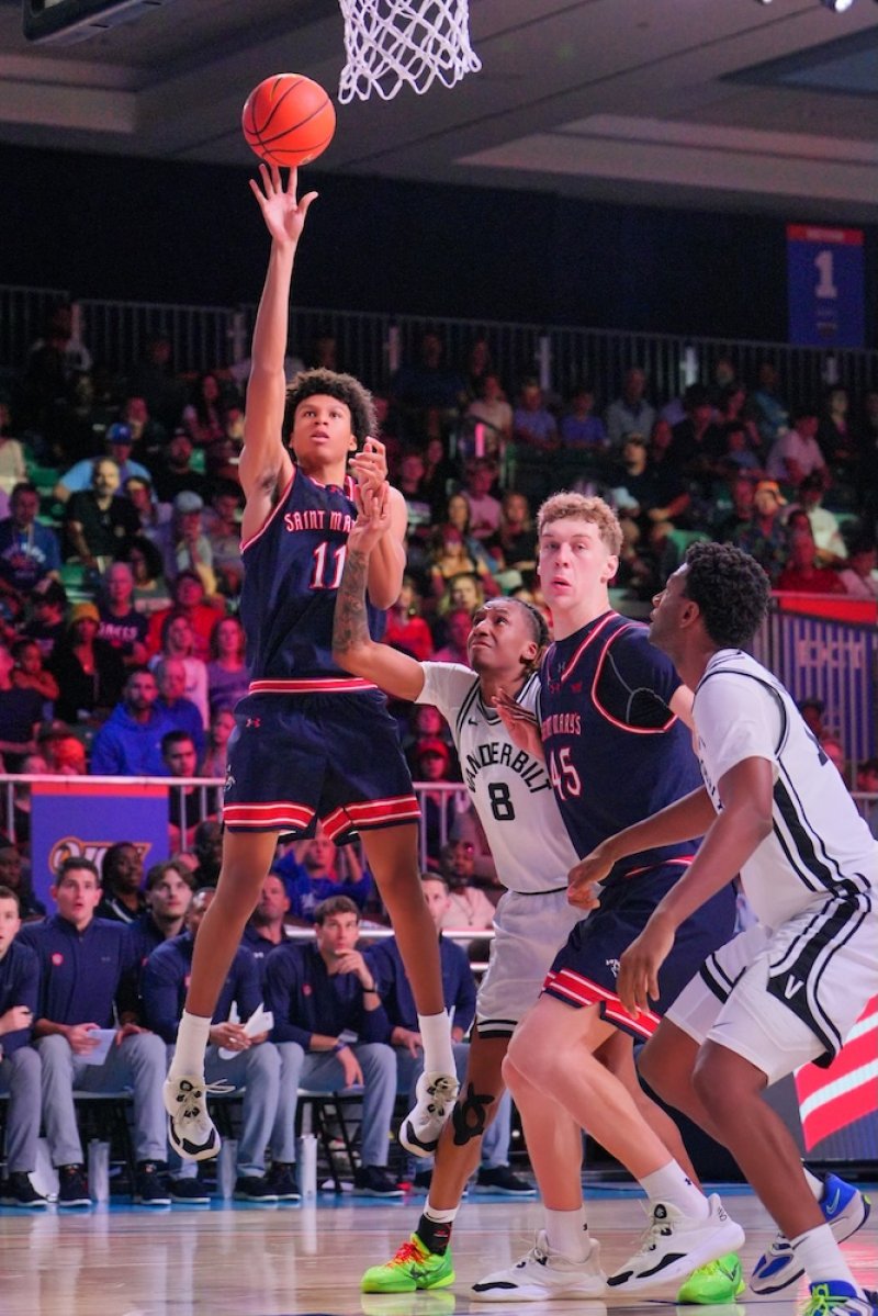 Basketball player Dillan Shaw shoots against Vanderbilt in November 2025