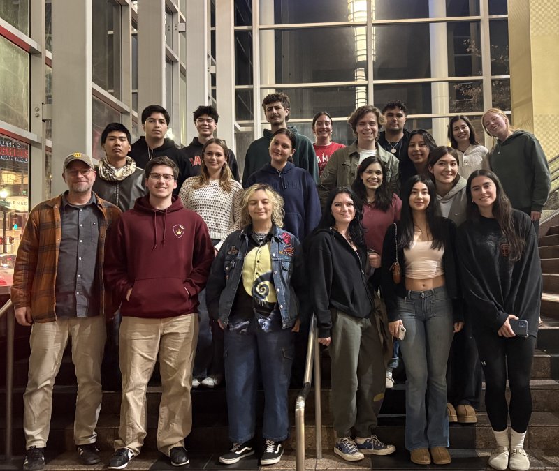 Group shot of Jason Jakaitis and his students in movie theater