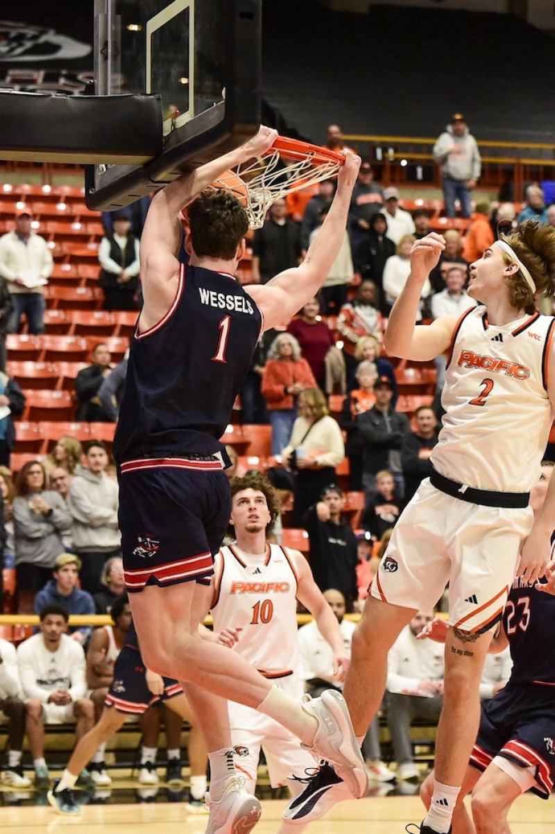 Basketball player Harry Wessels scores against Pacific in February 2026