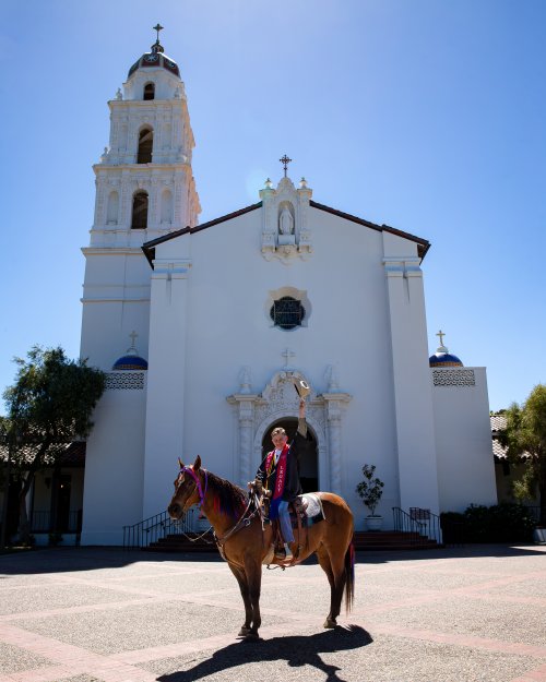 Page in his graduation regalia on Bart in front of the Saint Mary's chapel.