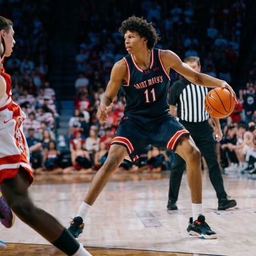 Men's Basketball player Dillan Shaw looks to shoot against Arizona in October 2025