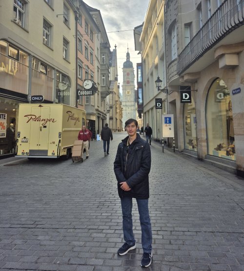 Chris Baker posing on a street in Italy