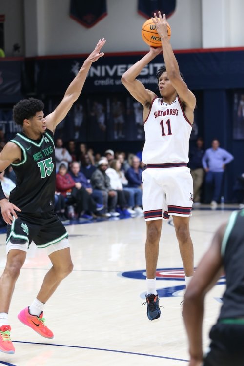 Men's basketball player Dillan Shaw shoots against North Texas in November 2025