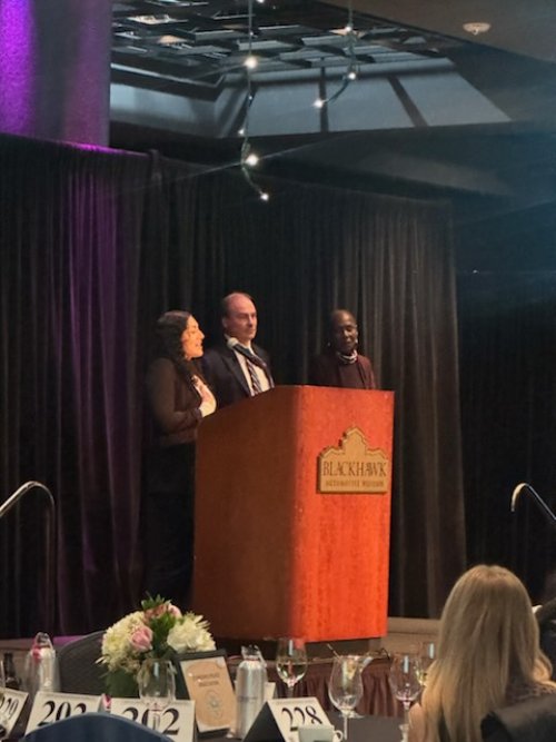 Daryanna accepting her award, standing with Cynthia Peterson and Paul Graves