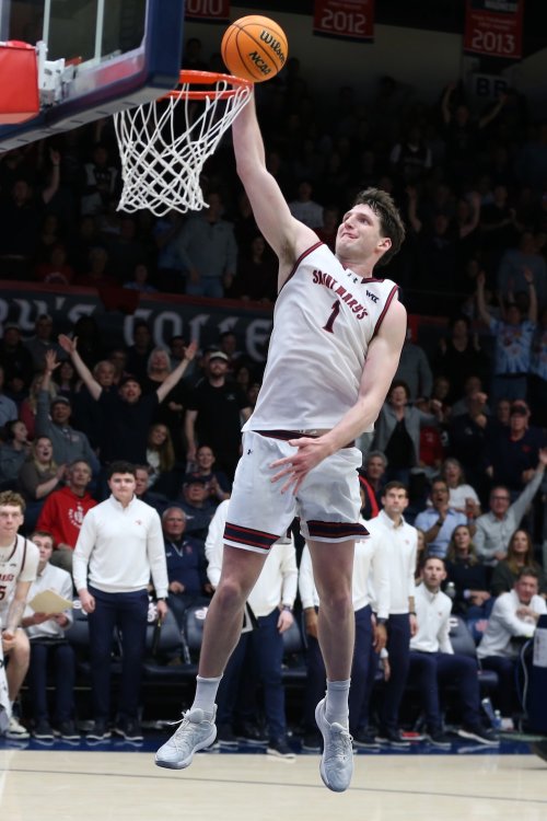 Basketball player Harry Wessels dunks against Santa Clara in February 2026
