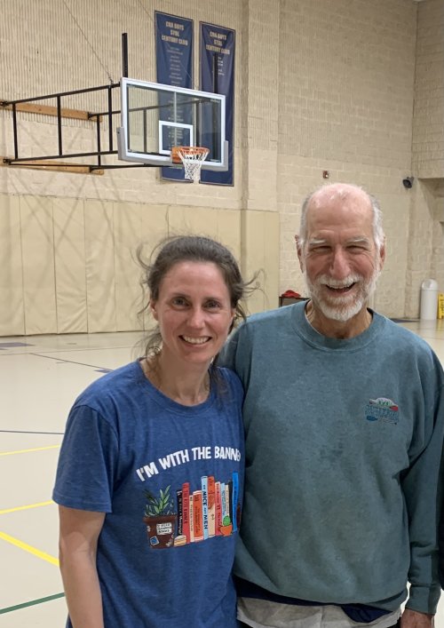 Mary Volmer and her friend Michael play basketball 