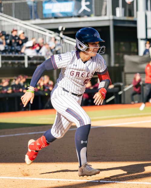 Softball player Sam Buckley runs after hitting in 2026 NCAA Regional Final