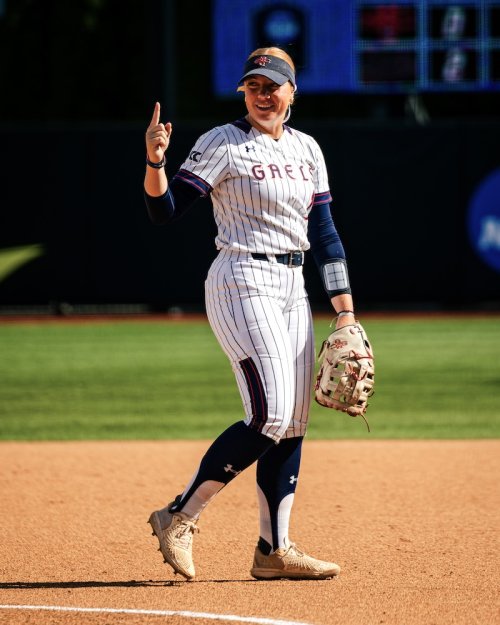 Pitcher Ella Thurman on the field holding up one finger at 2026 NCAA Regional Final 