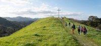 Students walking up to the Cross
