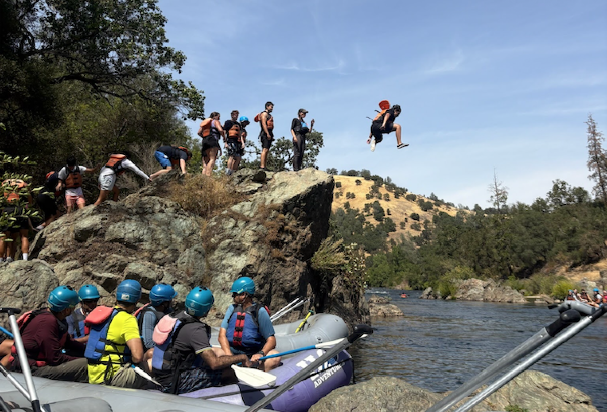 Leaping into adventure! Eric Garcia ‘28 takes the plunge to cool off in the river.