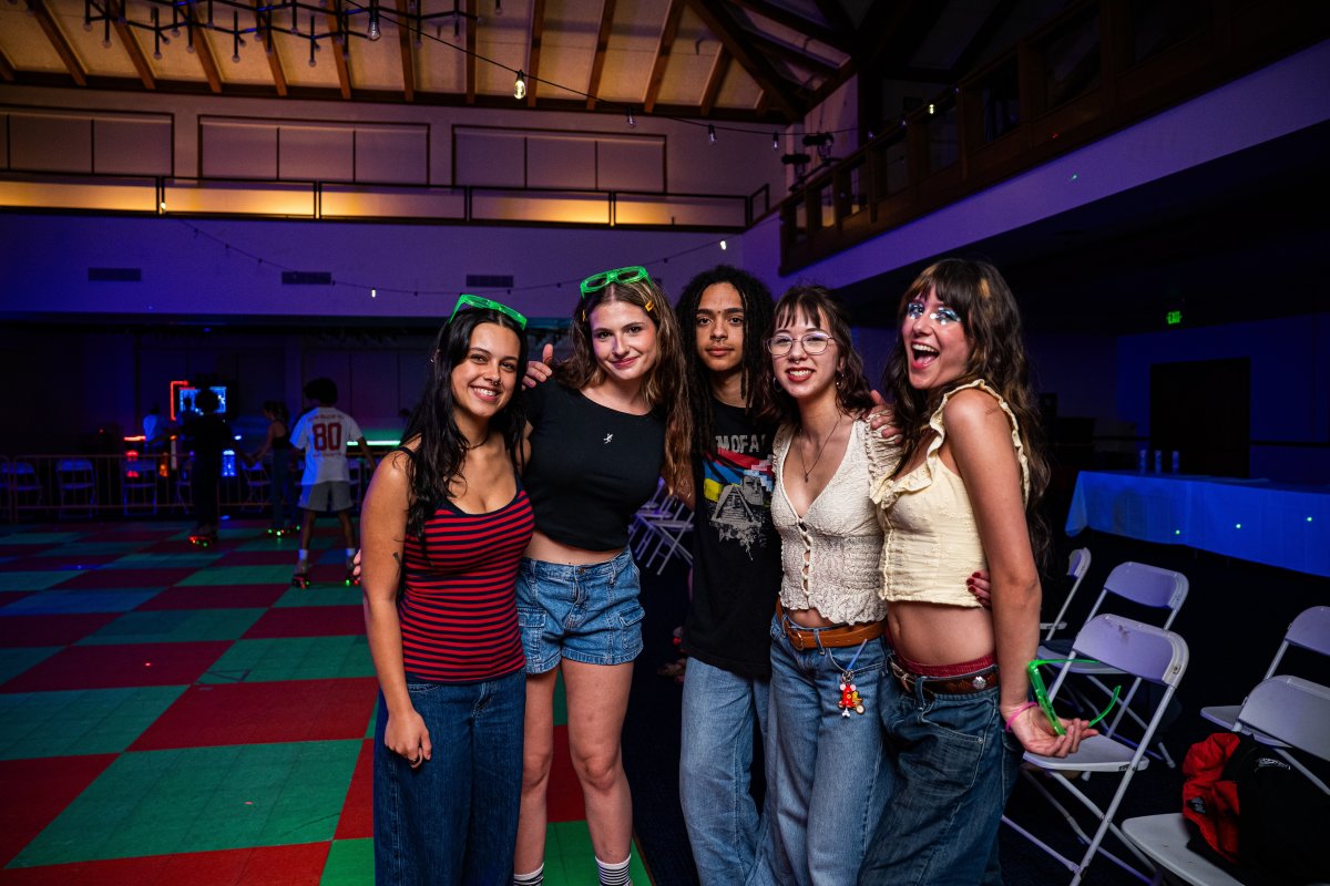 Students smiling on the skating rink at Glow SMC 2026