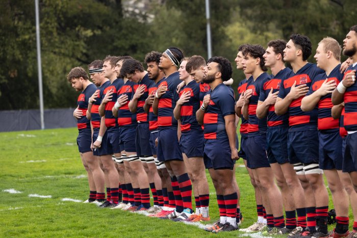 Men's Rugby standing for National Anthem