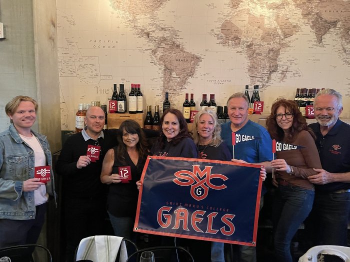 Alumni hold a Gaels banner