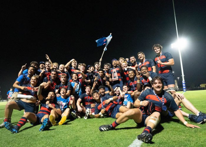 SMC Men's Rugby poses for a group photo on the pitch after winning 2024 National Championship