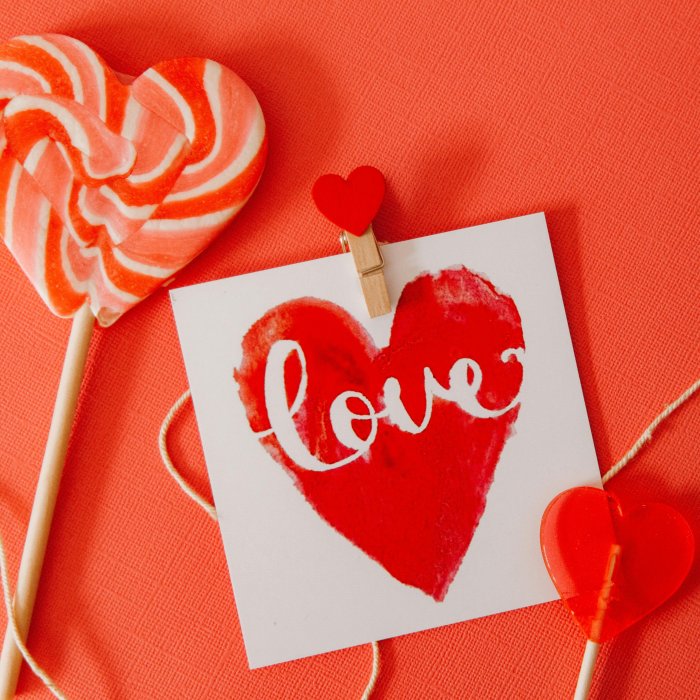 a red heart with the word love