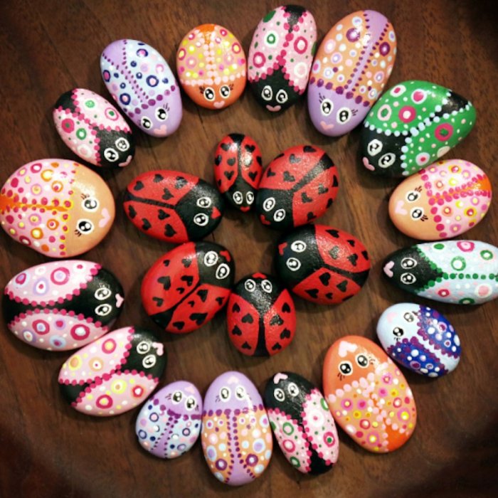 colorful painted rocks that look like bugs 