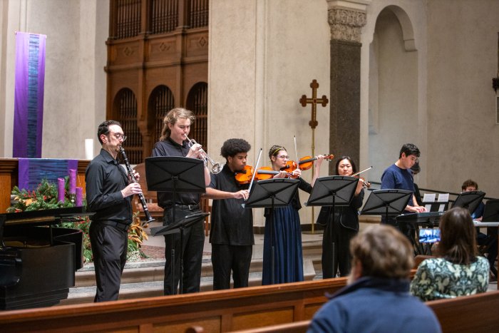 instrumental students play instruments on the altar in SMC's Chapel