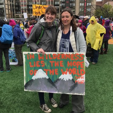 EES student with Faculty member at a climate rally