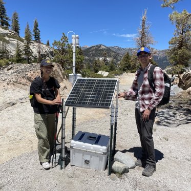 2 students with air quality monitor in Devils Postpile National Park