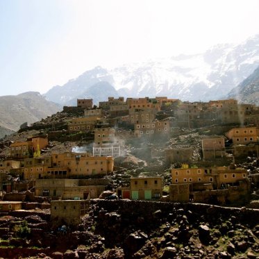 A hill in Morocco covered in small buildings