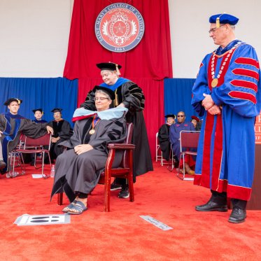 A Phd graduate receiving their hood