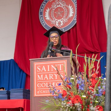 Kalina Bryant giving the commencement address on stage