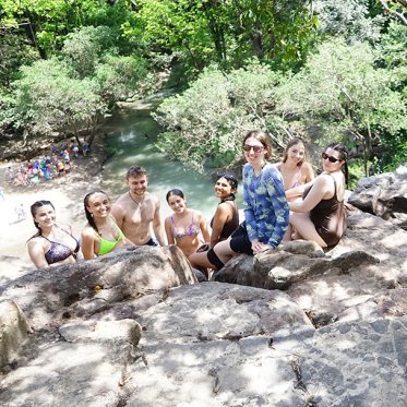 Students on a waterfall cliff