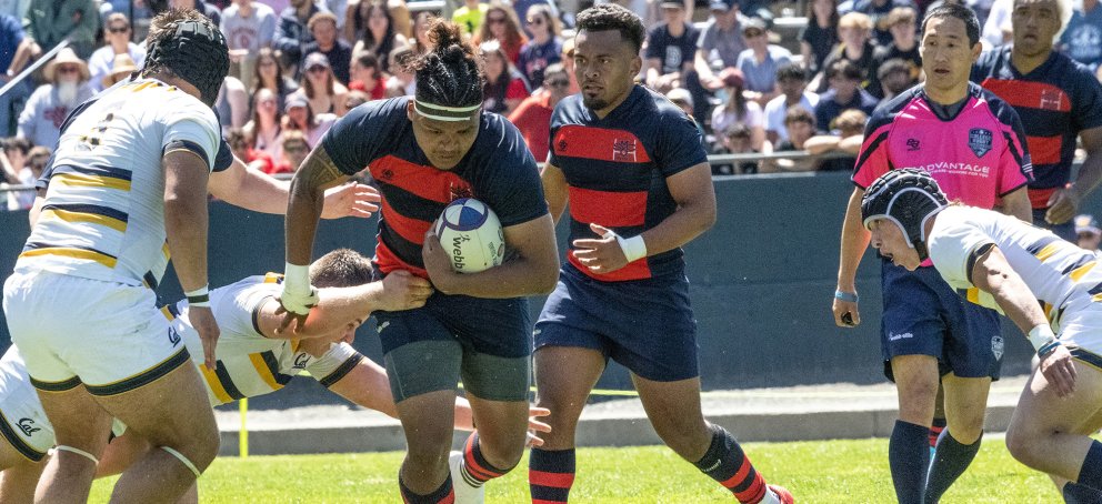 Two Saint Mary's rugby players run against UC Berkeley players on April 15 2023