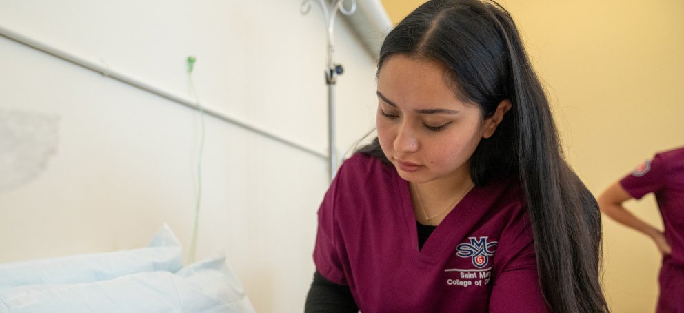 A Nursing student giving oxygen