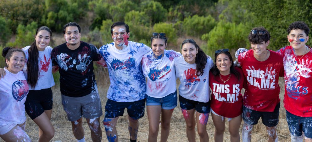 Saint Mary's Students covered in paint standing together