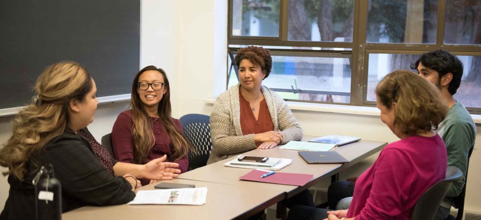Saint Mary's graduate students in class having a discussion