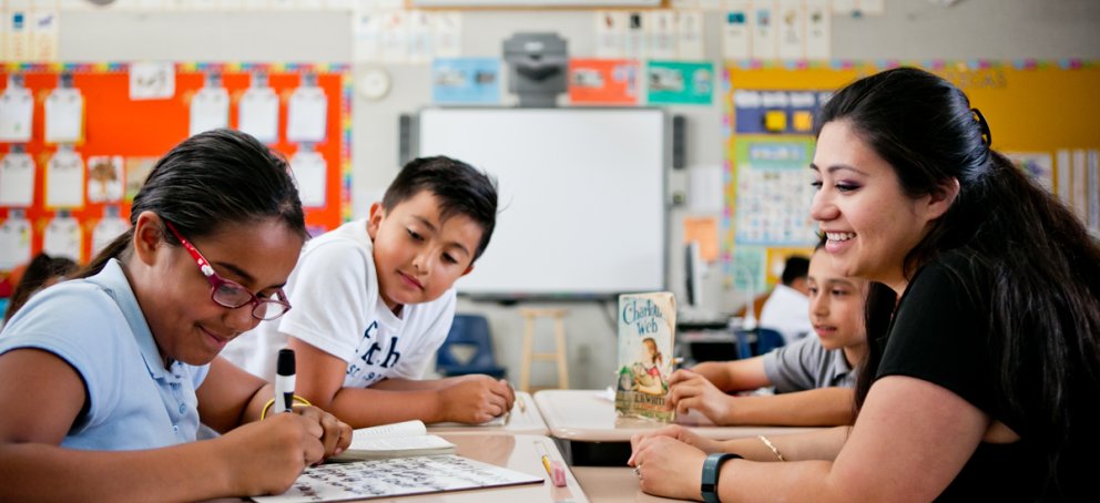 A teacher in a classroom with kids