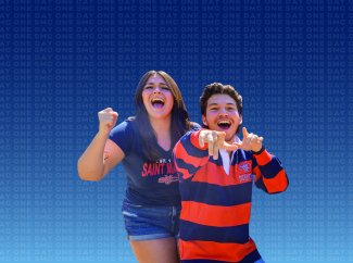 Students cheering at Saint Mary's College of California in front of One Day One SMC 