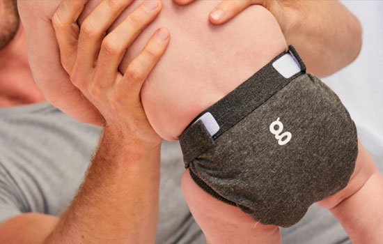 photo of gdiaper with man holding baby