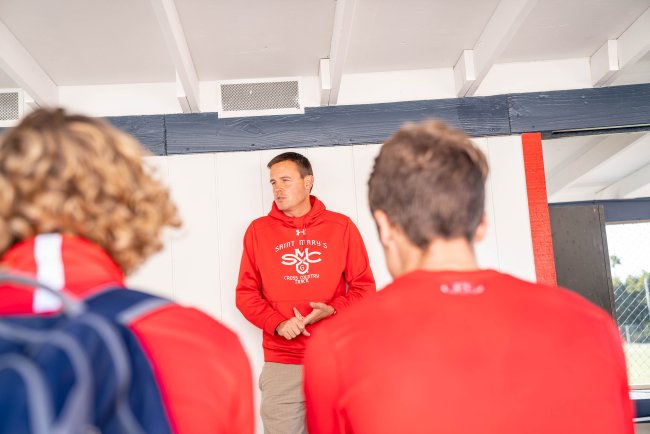 Marty Kinsey talks to cross country student-athletes