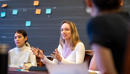 women speaking in classroom