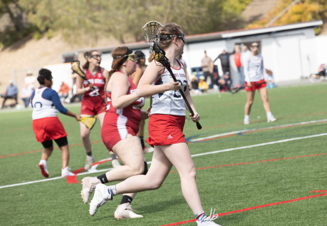 Senior Grace Kennedy transitions the ball up the field for an assist.