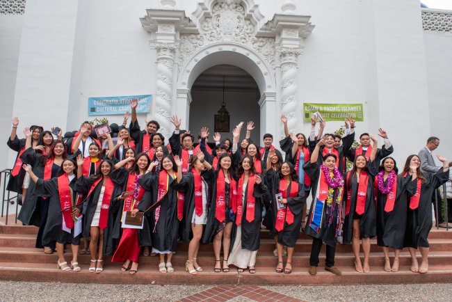 Students at thw 2024 API Graduate Celebration standing on the Chapel steps