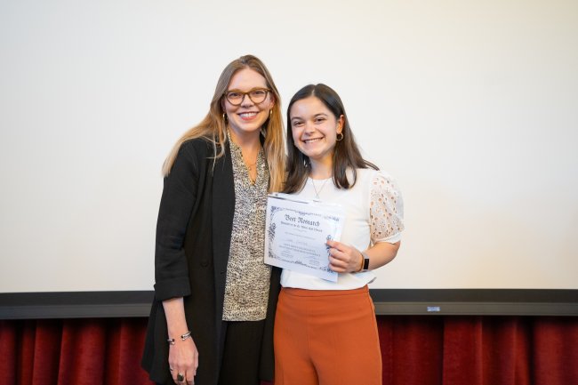 Student receiving a best presentation research award